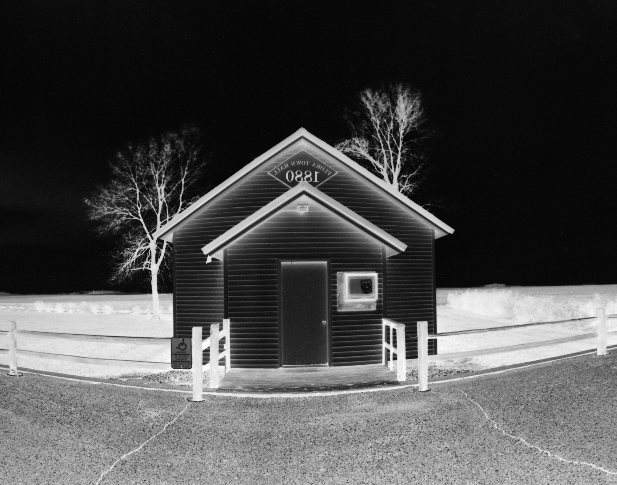 Flora - Approaching: Formal portrait of the Flora Township hall.
